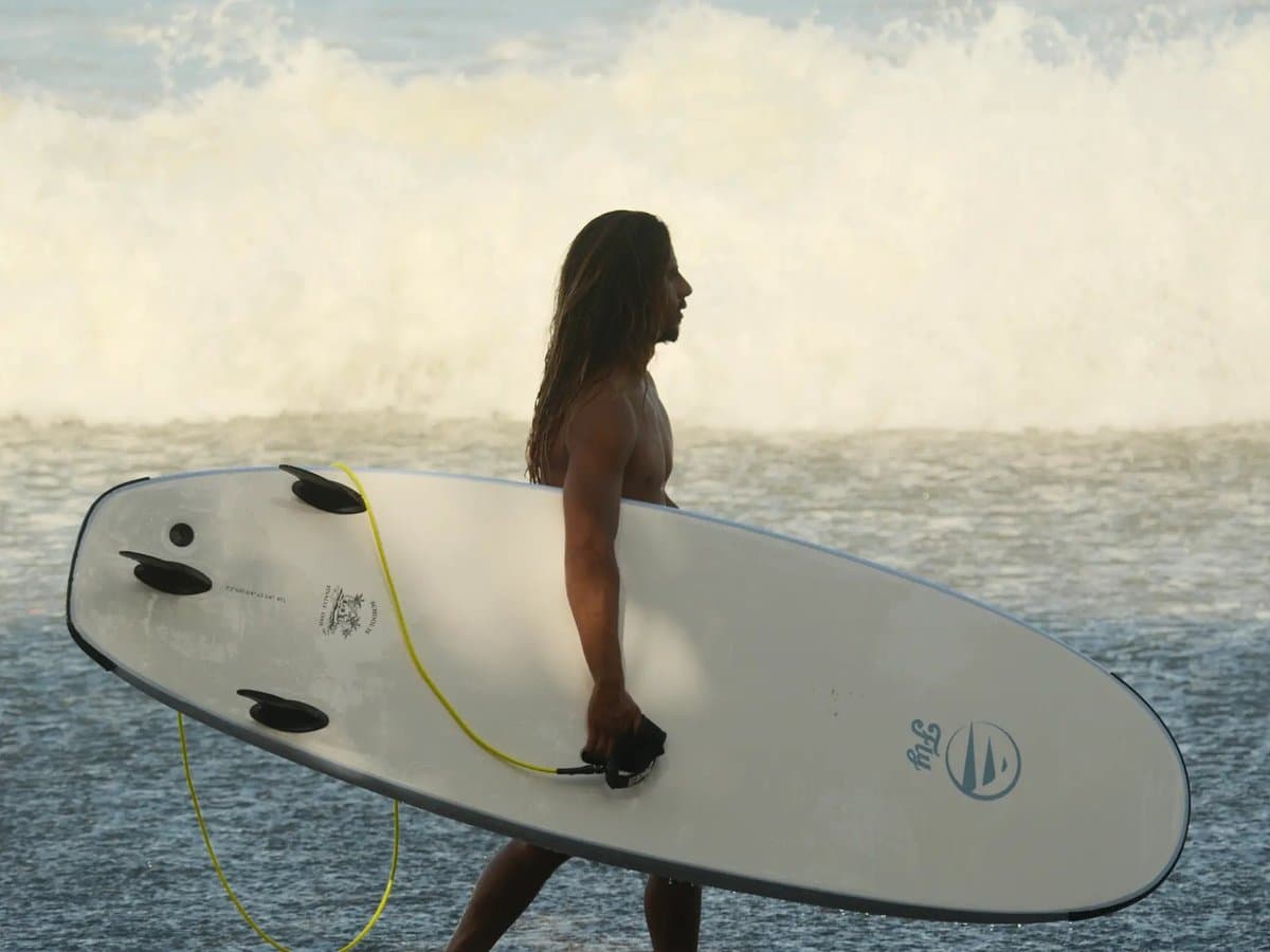 8'2 soft-top funboard rental in Aljezur — 98 litres of float for beginners, delivered to your accommodation